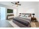 Serene main bedroom featuring neutral tones, modern furnishings, and a door to the main bathroom at 6233 Dewdrop Way # 6233, Tampa, FL 33617