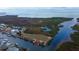 Coastal vacant lot with a dock offers serene waterfront views and easy access to the bay at 7034 Southwind Dr, Hudson, FL 34667
