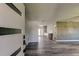 Modern home entryway with sleek door, beautiful floors, and an open view into a spacious living area at 7034 Southwind Dr, Hudson, FL 34667