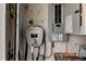Garage featuring an EV charger and electrical panel at 7034 Southwind Dr, Hudson, FL 34667