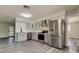 Modern kitchen with stainless steel appliances, ample storage, and stylish countertops, perfect for cooking at 7034 Southwind Dr, Hudson, FL 34667