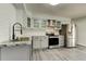 Updated kitchen with stainless steel appliances, granite countertops, and white subway tile backsplash at 7034 Southwind Dr, Hudson, FL 34667