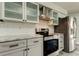 Updated kitchen with stainless steel appliances, granite countertops, and white subway tile backsplash at 7034 Southwind Dr, Hudson, FL 34667