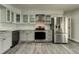 Updated kitchen with stainless steel appliances, granite countertops, and white subway tile backsplash at 7034 Southwind Dr, Hudson, FL 34667