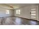 This living room boasts gray waterproof floors and a new front door at 7034 Southwind Dr, Hudson, FL 34667