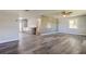 The living room features modern, gray, waterproof floors and a decorative accent wall at 7034 Southwind Dr, Hudson, FL 34667
