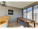 Outdoor patio with wooden bar, table and sliding windows and doors, perfect for a dining area at 7034 Southwind Dr, Hudson, FL 34667