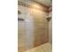 This is a tile shower with a shower caddy and two soap dishes at 7034 Southwind Dr, Hudson, FL 34667
