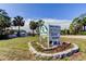 Community sign indicating a deed-restricted, golf access neighborhood, offering a glimpse of the lifestyle at 7034 Southwind Dr, Hudson, FL 34667