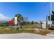A gated community entrance to a vacant lot ready for new construction at 7034 Southwind Dr, Hudson, FL 34667