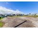 A vacant lot on a partially paved surface surrounded by community homes at 7034 Southwind Dr, Hudson, FL 34667