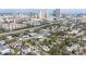 Aerial view of neighborhood with skyline featuring houses, trees, and skyscrapers at 709 W Azeele St, Tampa, FL 33606