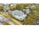 Aerial view of a two-story home featuring gray shingles, black shutters, and a covered porch at 709 W Azeele St, Tampa, FL 33606