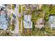 Top-down aerial of home with a gray shingle roof, surrounded by mature trees at 709 W Azeele St, Tampa, FL 33606