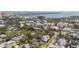 Charming neighborhood with lush green trees, diverse architecture, and a serene waterfront backdrop at 709 W Azeele St, Tampa, FL 33606