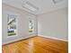 Bedroom with hardwood floors, natural light, and neutral walls creates a relaxing atmosphere at 709 W Azeele St, Tampa, FL 33606