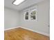 Bedroom with hardwood floors, natural light, and neutral walls creates a relaxing atmosphere at 709 W Azeele St, Tampa, FL 33606