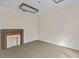 Cozy bedroom with a decorative fireplace, carpeted floor, and neutral color palette at 709 W Azeele St, Tampa, FL 33606