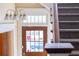 Entryway featuring a staircase and wood door with glass panels at 709 W Azeele St, Tampa, FL 33606