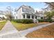 Charming two-story home with a front porch and mature landscaping at 709 W Azeele St, Tampa, FL 33606