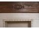 Close-up of the fireplace with decorative molding, white tile, and wood mantel at 709 W Azeele St, Tampa, FL 33606