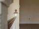 Hallway with neutral paint and trim, showing carpeted floors and staircase at 709 W Azeele St, Tampa, FL 33606