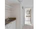 Hallway with sink, tiled floor, and doorway leading to a bathroom at 709 W Azeele St, Tampa, FL 33606