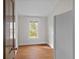 Kitchen area with wood floors, a window with natural light, and a white refrigerator at 709 W Azeele St, Tampa, FL 33606