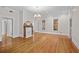 Spacious living room with hardwood floors, fireplace, and natural light creates a warm and inviting atmosphere at 709 W Azeele St, Tampa, FL 33606