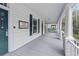 Inviting porch with painted columns and floor, offering a relaxing outdoor space with a view at 709 W Azeele St, Tampa, FL 33606