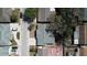 Birds-eye view of neighborhood with a grey rooftop, mature trees, and outdoor living area with patio furniture at 7144 Fairfax Dr, Port Richey, FL 34668