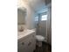 Modern bathroom features a shower, sleek vanity, and neutral color scheme at 7144 Fairfax Dr, Port Richey, FL 34668