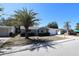 Charming single-story home featuring a mature palm tree and a well-maintained front lawn at 7144 Fairfax Dr, Port Richey, FL 34668
