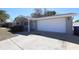 Exterior angle of the garage doors and driveway of the single-story house at 7144 Fairfax Dr, Port Richey, FL 34668