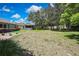 Large, grassy backyard with mature trees offering ample shade and privacy at 8045 Sugarbush Dr, Spring Hill, FL 34606