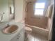 Full bathroom featuring a tub and shower combination and a well-lit vanity at 8045 Sugarbush Dr, Spring Hill, FL 34606