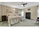 Cozy bedroom featuring patterned wallpaper, neutral carpeting, twin beds, and classic dark wood furniture at 8045 Sugarbush Dr, Spring Hill, FL 34606