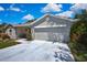 Charming home with a two-car garage, covered porch, and well-maintained landscaping at 8045 Sugarbush Dr, Spring Hill, FL 34606