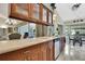 Bright kitchen featuring wood cabinets, light countertops, and a breakfast nook in an inviting home at 8045 Sugarbush Dr, Spring Hill, FL 34606