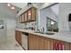 Well-lit kitchen with updated appliances, ample counter space, and seamless flow to the breakfast nook at 8045 Sugarbush Dr, Spring Hill, FL 34606