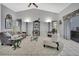 Bright living room features high ceilings, tile floors, and is decorated with modern furniture at 8045 Sugarbush Dr, Spring Hill, FL 34606