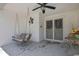 Covered patio area with a hanging swing and ceiling fan for outdoor relaxation at 8045 Sugarbush Dr, Spring Hill, FL 34606