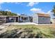 Backyard showcasing a patio area and a storage shed, ideal for outdoor activities and storage solutions at 9316 Mark Twain Ln, Port Richey, FL 34668