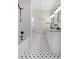 Bathroom featuring a tub-shower combo, hex tile flooring, and a dual sink vanity at 951 9Th S Ave, St Petersburg, FL 33705