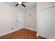 Bedroom featuring hardwood floors, a ceiling fan, and a closet with a minimalist design at 951 9Th S Ave, St Petersburg, FL 33705
