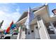 Exterior detail of home featuring flags, brick steps, and neutral gray paint at 951 9Th S Ave, St Petersburg, FL 33705
