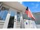 Exterior detail of home entrance featuring American flag and digital door lock at 951 9Th S Ave, St Petersburg, FL 33705