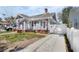 Charming single-Gathering home boasting a manicured lawn, driveway, brick steps, and inviting front porch at 951 9Th S Ave, St Petersburg, FL 33705