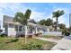 Charming single-Gathering home with quaint front porch, brick steps, palm trees, and well-kept front yard at 951 9Th S Ave, St Petersburg, FL 33705