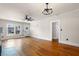 Bright living room features hardwood floors, ceiling fan and natural light from the windows at 951 9Th S Ave, St Petersburg, FL 33705